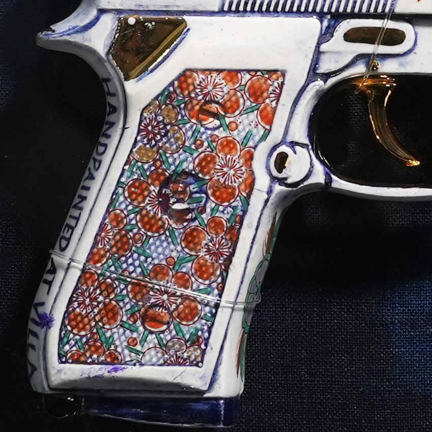 Detail of the grip in Imari brocade pattern, signed Handpainted at Villa Delirium in underglaze blue